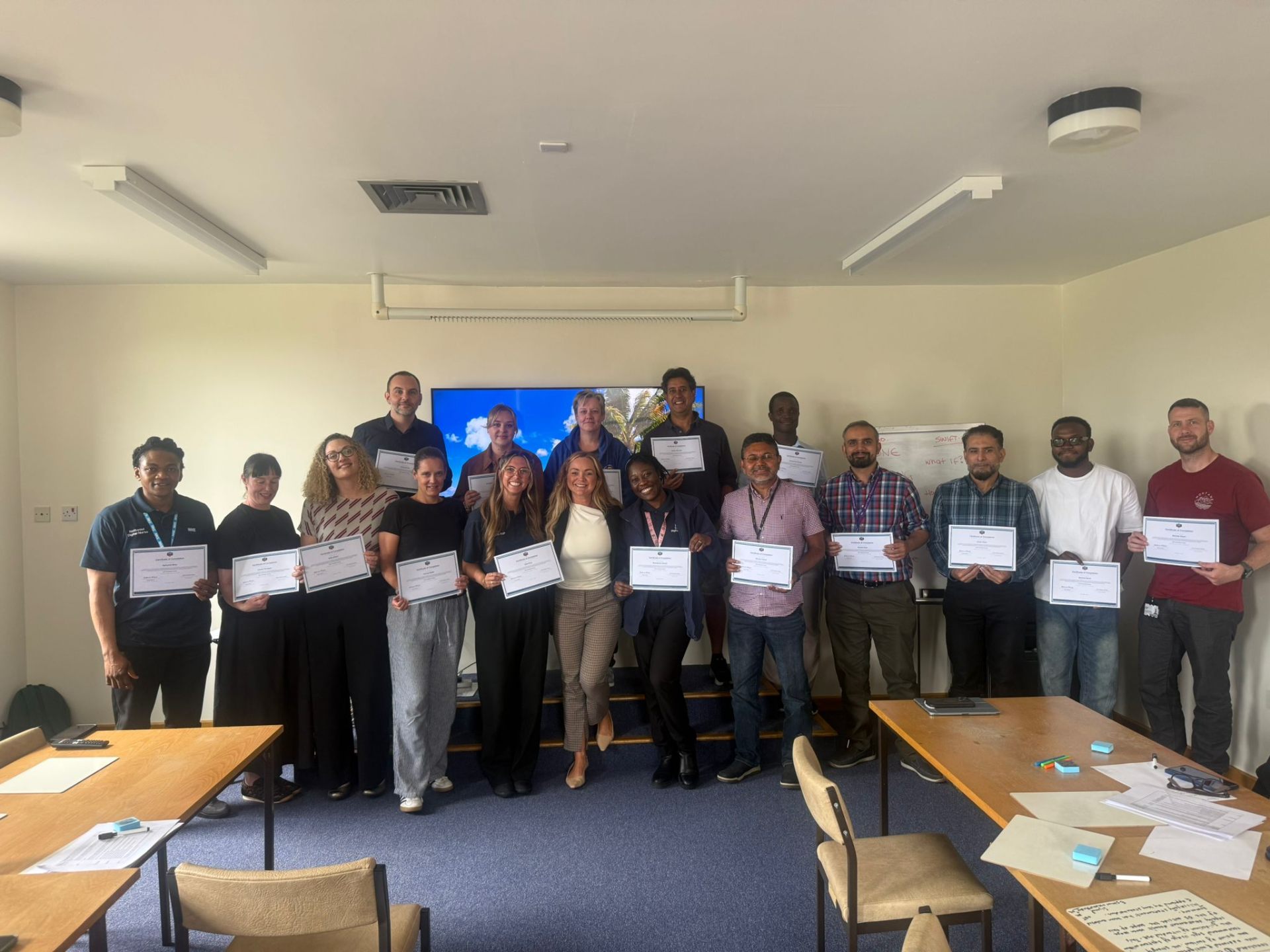 CSO Training Academy cohort with certificates
